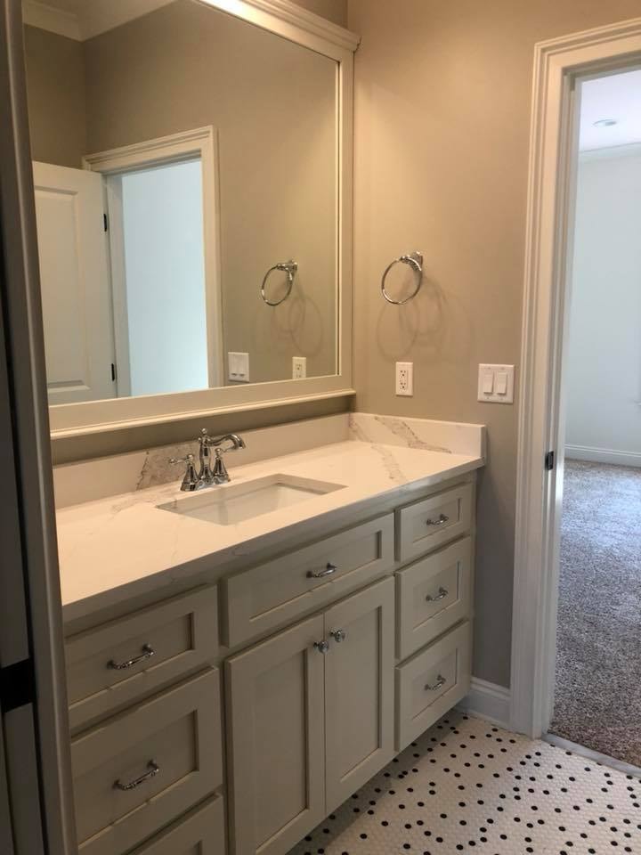 Bathroom vanity with quartz countertop and custom cabinetry