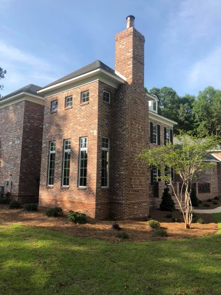Side view of brick colonial with chimney detail