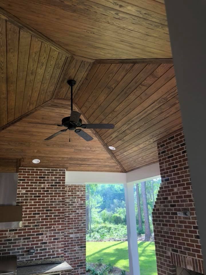 Covered patio with tongue-and-groove wood ceiling and ceiling fan