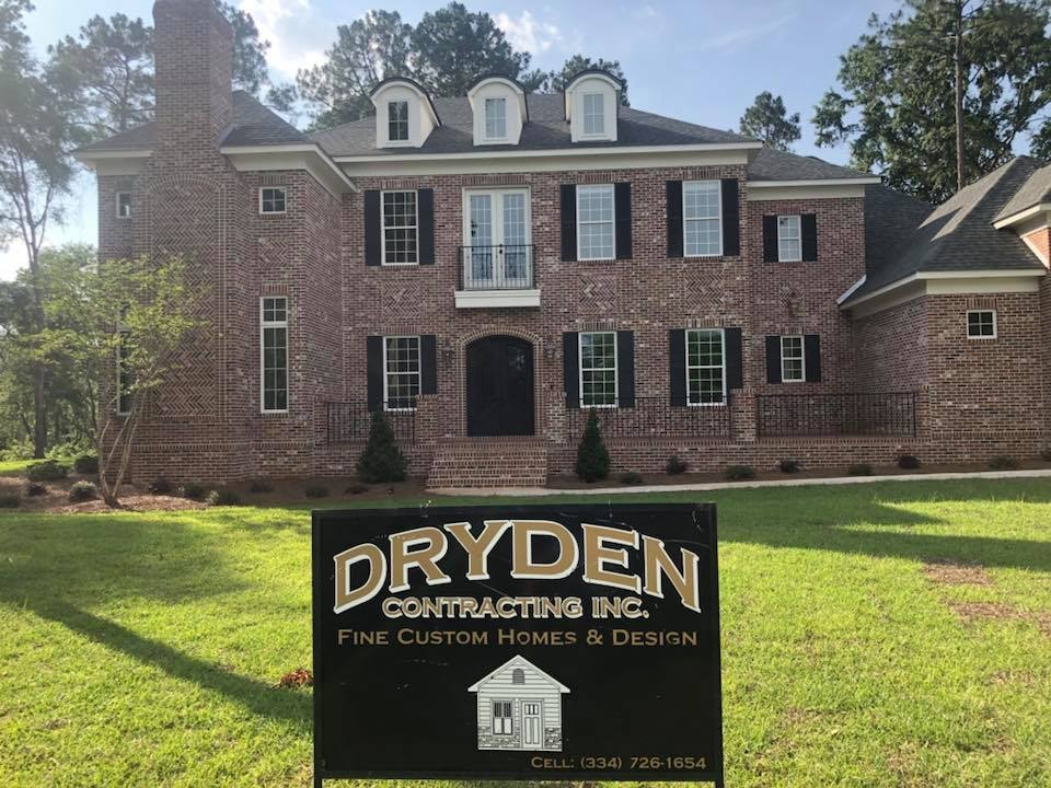 Brick colonial home with Dryden Contracting yard sign